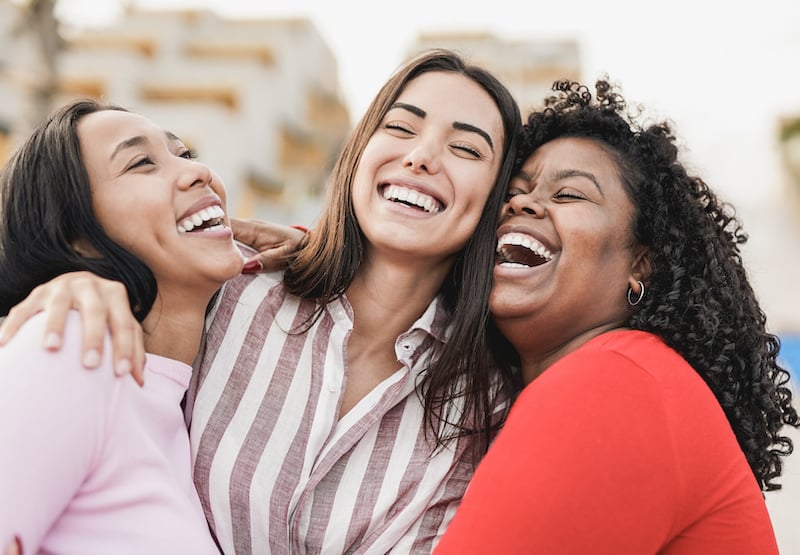 3 people smiling from financial freedom