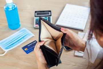 Person looking at empty wallet