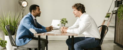 two men talking to each other