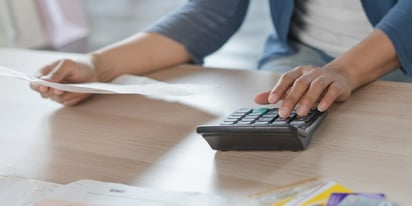 Woman working on debt consolidation program