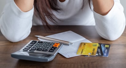 Person stressing over getting out of debt