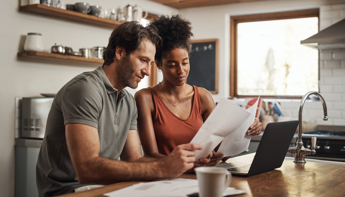 Two people considering their debt management options