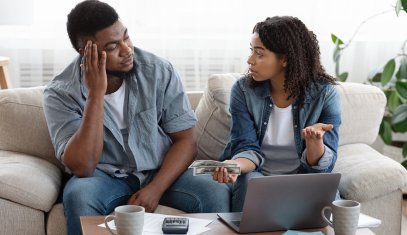 couple discussing their finances and how to not overspend