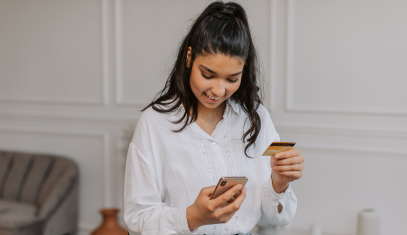 woman using her credit card to shop online