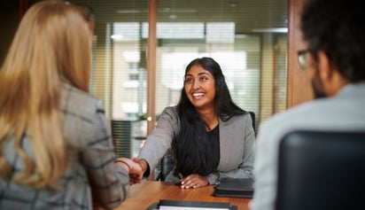 woman shaking hands with a tax expert