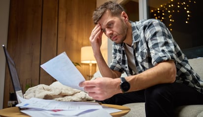 man stressed with his finances