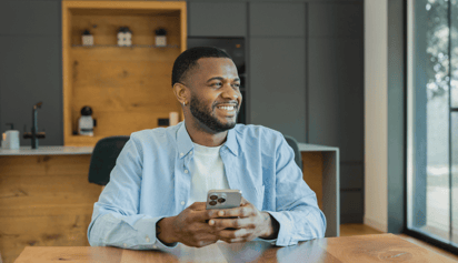 man smiling and staring into the distance