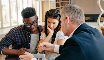a couple discussing their mortgage with a specialist