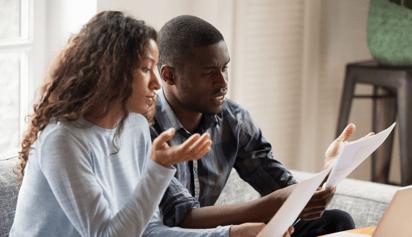 couple looking at a notice of collection letter