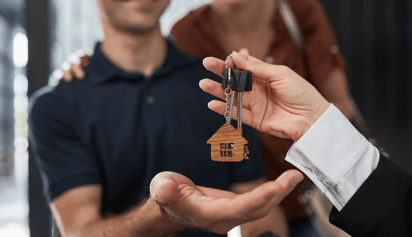 people buying a house and getting the keys