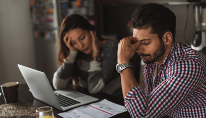 couple worried as they file their taxes