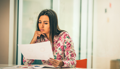 woman reading credit report