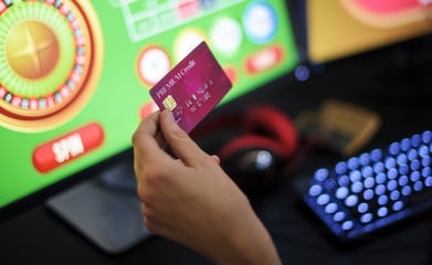 person gambling via iGaming online