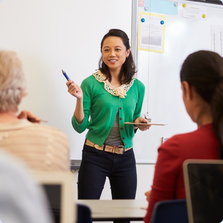 woman teaching adults