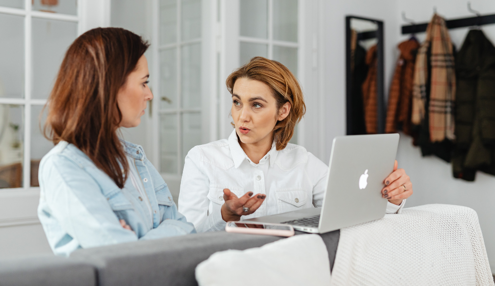 two women talking about loans