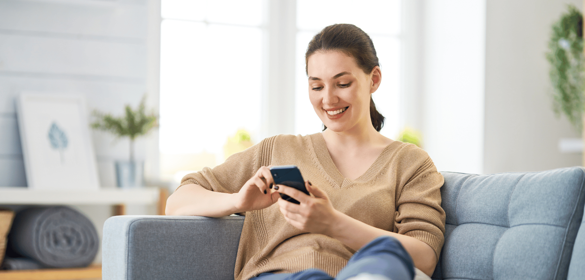woman on her phone checking her credit score