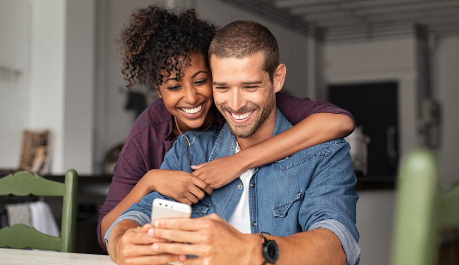 woman hugging a man and smiling