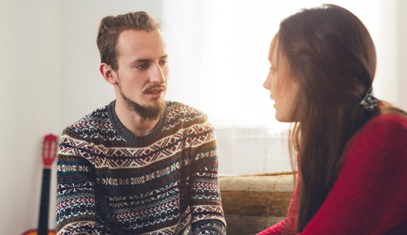 man and woman talking to each other